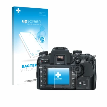 Vorderseite einer Produktverpackung mit dem Markenlogo upscreen. Daneben ist das Gerät Konica Minolta Dynax 7D mit dem zugehör