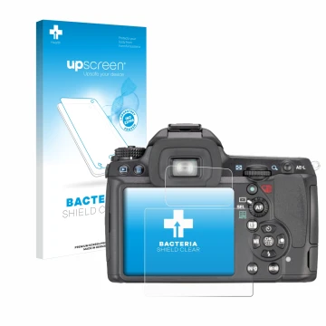 Vorderseite einer Produktverpackung mit dem Markenlogo upscreen. Daneben ist das Gerät Pentax K7, K-7 mit dem zugehörigen Disp