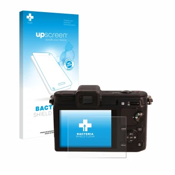 Vorderseite einer Produktverpackung mit dem Markenlogo upscreen. Daneben ist das Gerät Nikon 1 V1 mit dem zugehörigen Displays