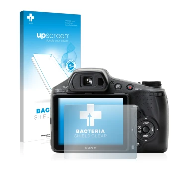 Vorderseite einer Produktverpackung mit dem Markenlogo upscreen. Daneben ist das Gerät Sony Cyber-Shot DSC-HX200V mit dem zuge