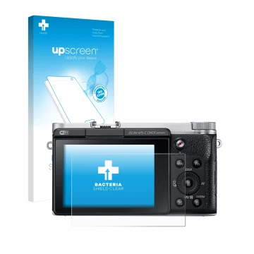 Vorderseite einer Produktverpackung mit dem Markenlogo upscreen. Daneben ist das Gerät Samsung NX300M mit dem zugehörigen Disp