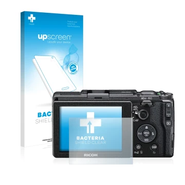 Vorderseite einer Produktverpackung mit dem Markenlogo upscreen. Daneben ist das Gerät Ricoh GR II 2015 mit dem zugehörigen Di