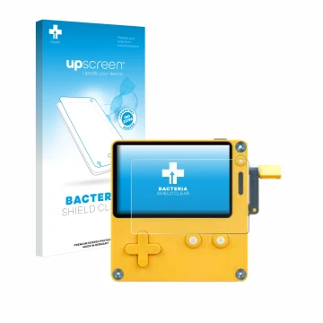 Vorderseite einer Produktverpackung mit dem Markenlogo upscreen. Daneben ist das Gerät Panic Playdate mit dem zugehörigen Disp