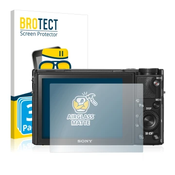 Vorderseite einer Produktverpackung mit dem Markenlogo BROTECT. Daneben ist das Gerät Sony Cyber-Shot DSC-RX100 V mit dem zuge